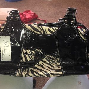 M.C handbag , “Genuine Leather”